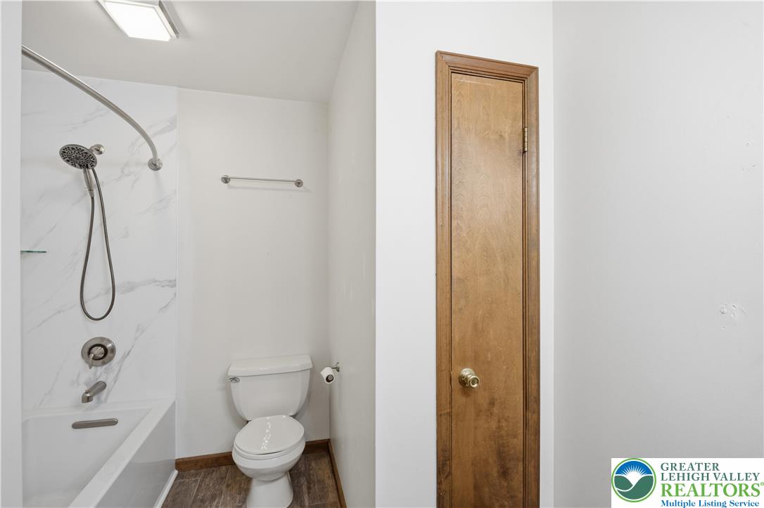 2160 Kecks Road Fogelsville, PA 18051 - Photo 51 of 58 a bathroom with a granite countertop shower a toilet and a sink