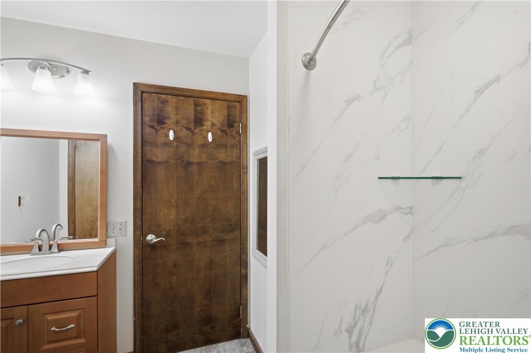 2160 Kecks Road Fogelsville, PA 18051 - Photo 52 of 58 a bathroom with a shower sink and mirror