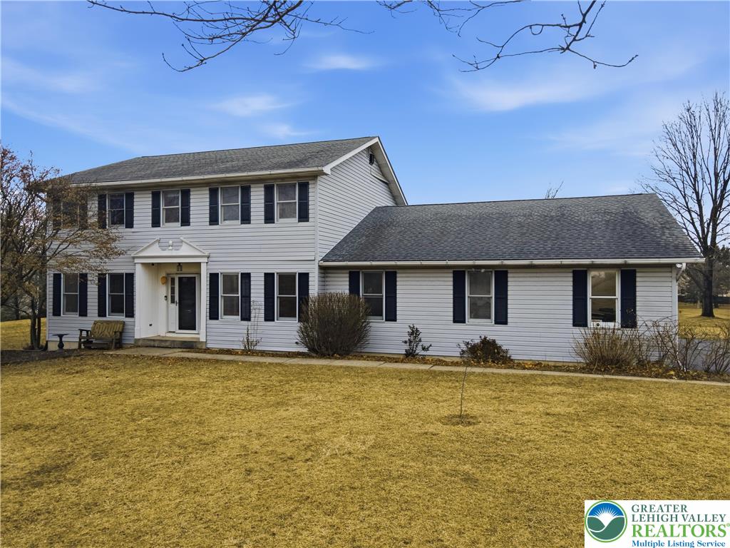2160 Kecks Road Fogelsville, PA 18051 - Photo 10 of 58 a front view of a house with swimming pool and porch with furniture