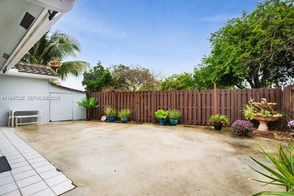 4917 Southwest 154th Avenue Miami, FL 33185 - Photo 21 of 34 a view of garden with patio
