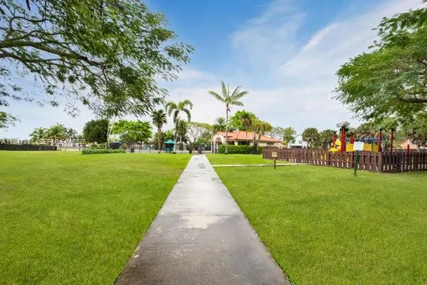 a view of a park with large trees