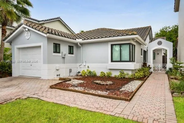 a front view of a house with garden