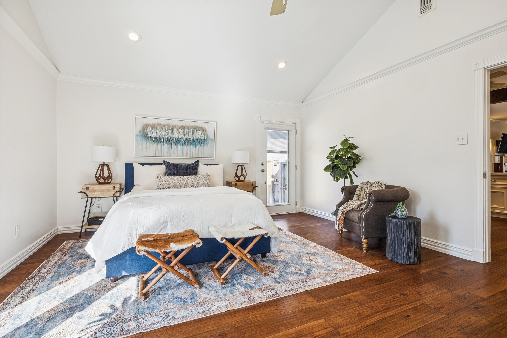 709 Walton Street Houston, TX 77009 - Photo 18 of 31 Primary bedroom with hardwood floors, recessed lighting, and direct access to the exterior.