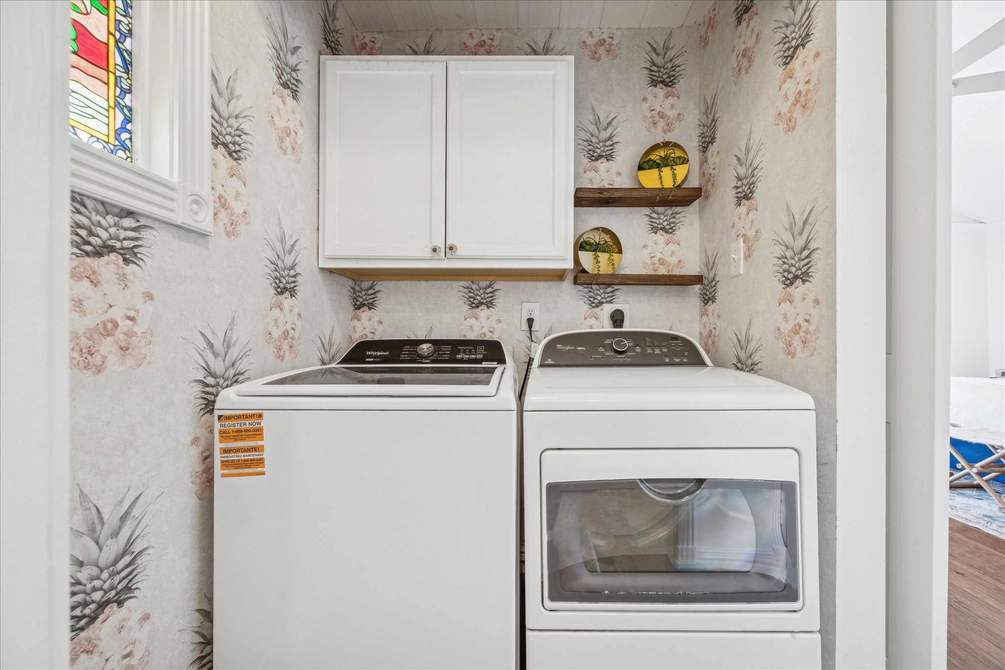 709 Walton Street Houston, TX 77009 - Photo 28 of 31 Laundry area with full-size washer and dryer, upper cabinets, and open shelving.