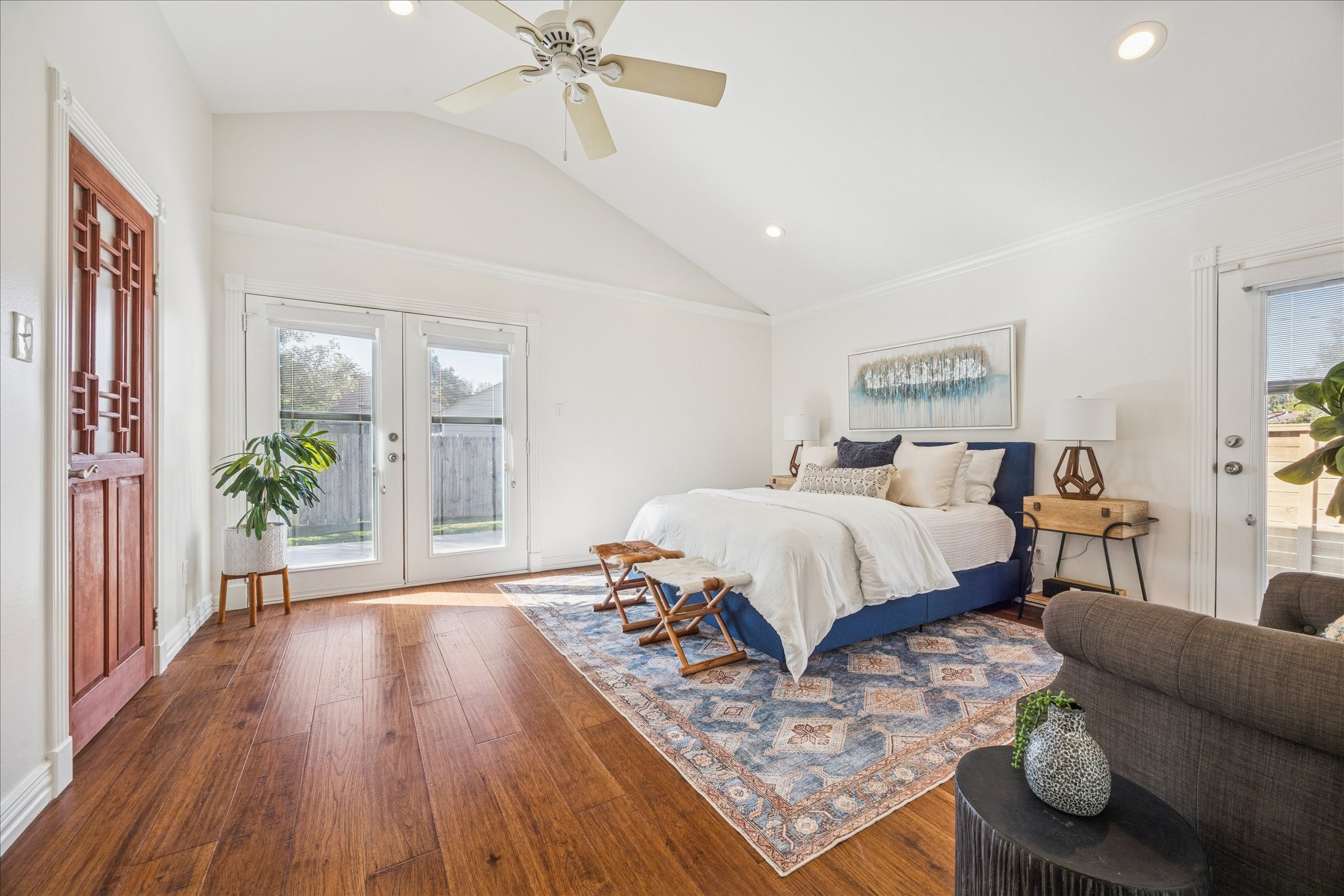 709 Walton Street Houston, TX 77009 - Photo 5 of 31 Large bedroom with clean finishes, ample natural light, and direct outdoor access.
