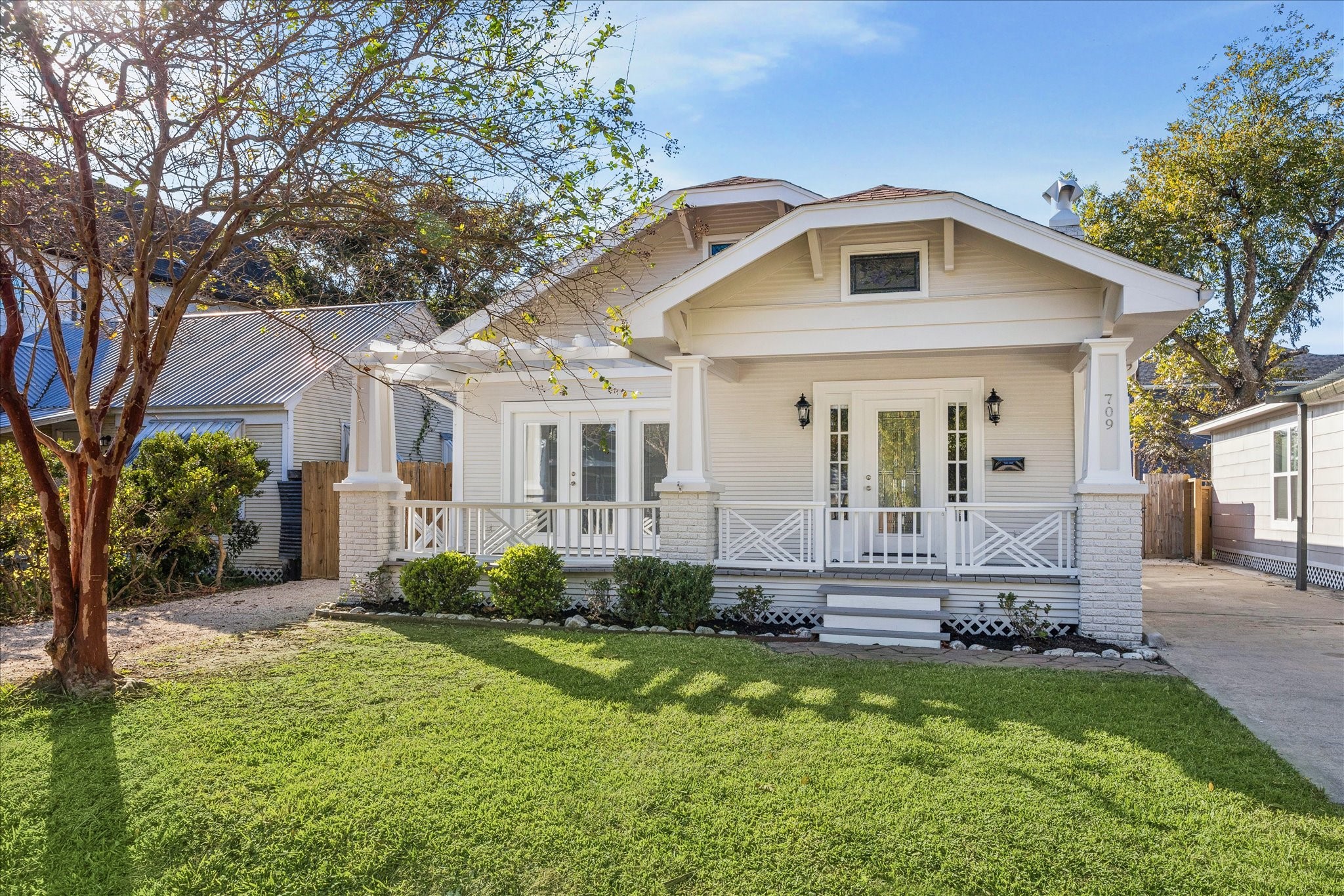 709 Walton Street Houston, TX 77009 - Photo 7 of 31 Attractive front view with porch entry, mature tree, and driveway access.