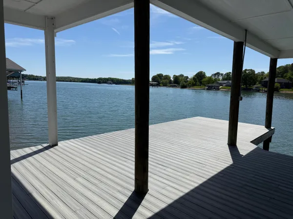 a deck view with a lake view