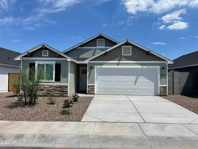 a front view of a house with yard