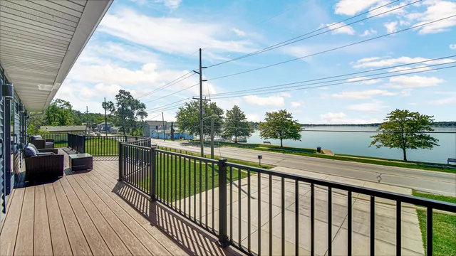 a bathroom with a double vanity sink toilet mirror and bathtub