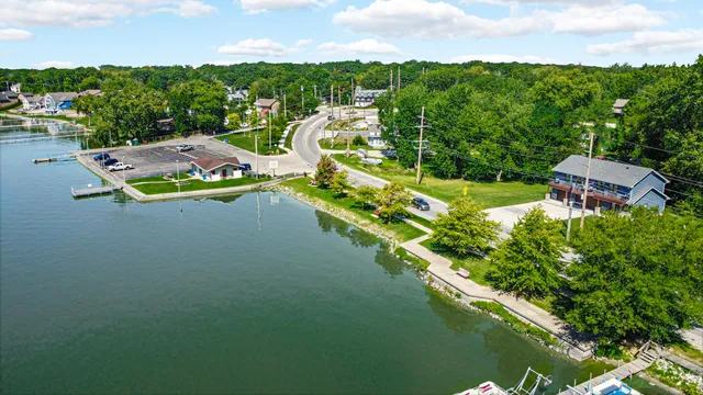 a front view of a house with a yard table and chairs