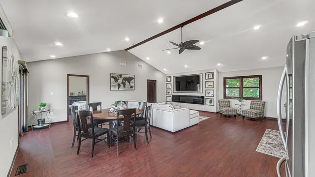 a view of a dining room with furniture window and wooden floor