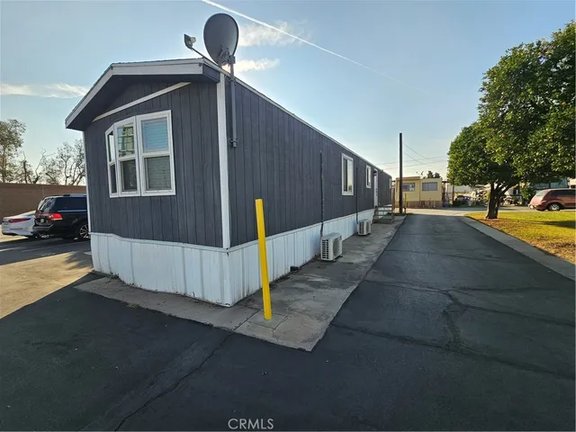 a view of a street with parking and a car parked