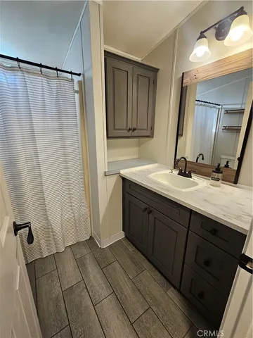 a bathroom with a double vanity sink and mirror