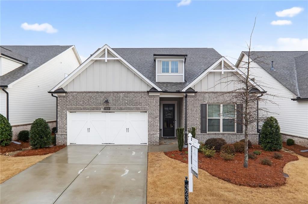 3230 Fitzgerald Way Cumming, GA 30041 - Photo 1 of 1 a front view of a house with garden