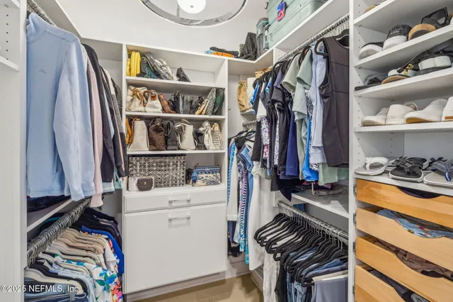a living room filled with furniture and a flat screen tv
