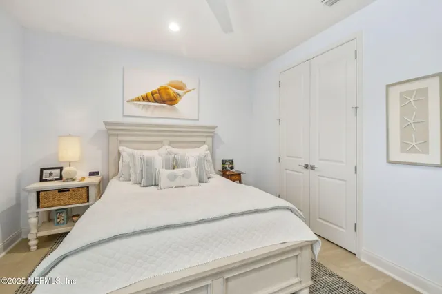 a front view of a house with a garden and patio