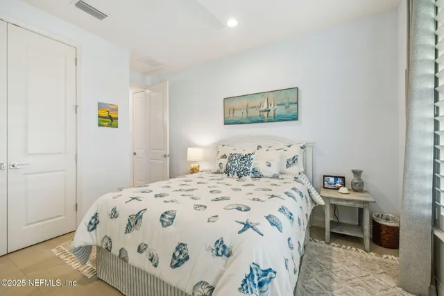 a view of a lake with houses in the background