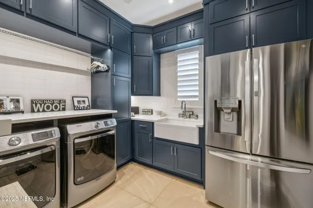 a view of a swimming pool with lawn chairs under an umbrella