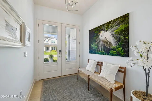 a bedroom with furniture and a flat screen tv