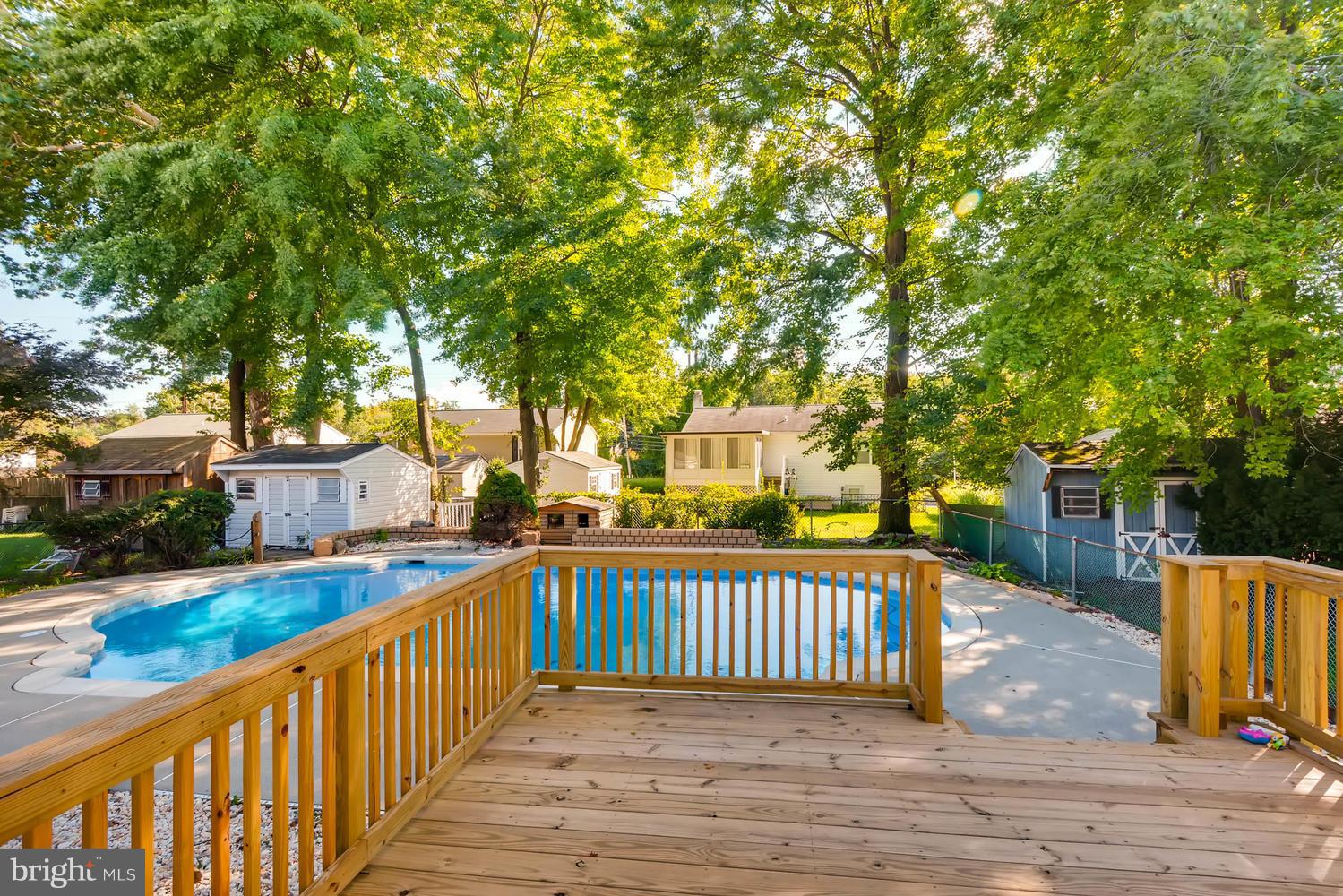 7 Raintree Court Baltimore, MD 21221 - Photo 22 of 27 New deck through sliding doors overlooking pool