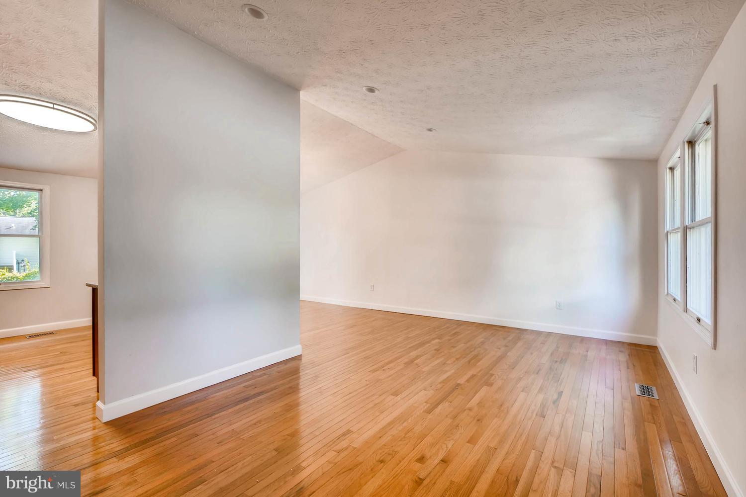 7 Raintree Court Baltimore, MD 21221 - Photo 4 of 27 Living Room w/ natural light and HW floors