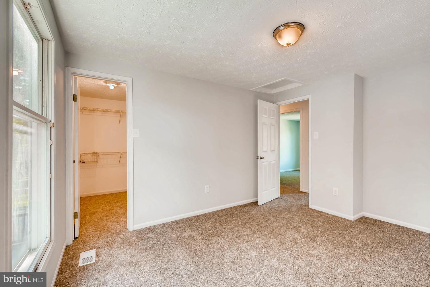 7 Raintree Court Baltimore, MD 21221 - Photo 10 of 27 Master BR w/ new carpet and walk in closet