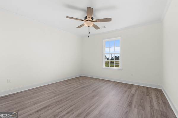 912 Ryegrass Road Statesboro, GA 30458 - Photo 12 of 19 wooden floor in an empty room with a window