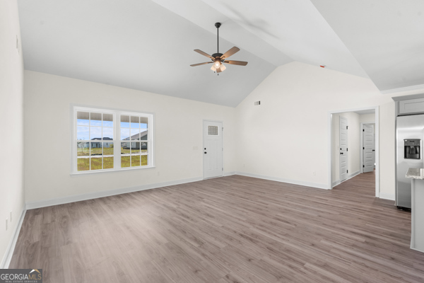 912 Ryegrass Road Statesboro, GA 30458 - Photo 3 of 19 wooden floor in an empty room with a window