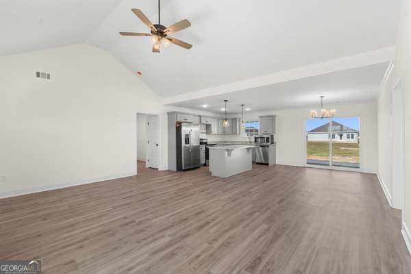 912 Ryegrass Road Statesboro, GA 30458 - Photo 4 of 19 a view of a kitchen with a sink a ceiling fan and wooden floor