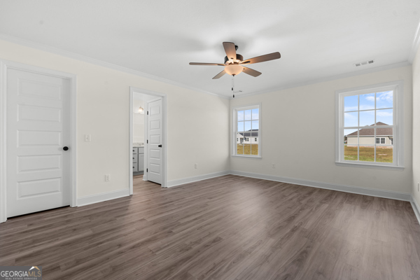 912 Ryegrass Road Statesboro, GA 30458 - Photo 9 of 19 wooden floor in an empty room with a window