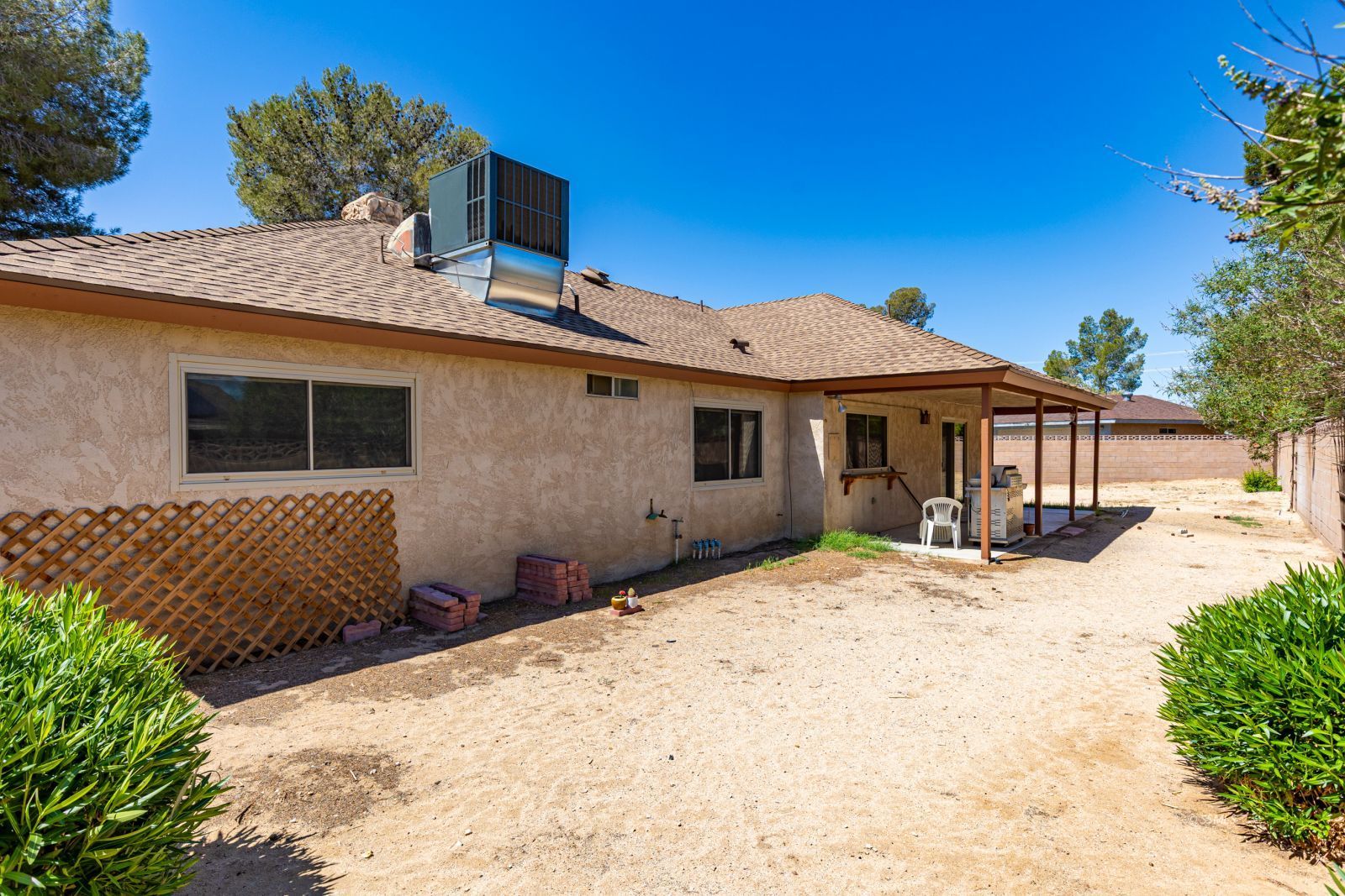 824 Kevin Way Ridgecrest, CA 93555 - Photo 33 of 38 a front view of a house with a yard