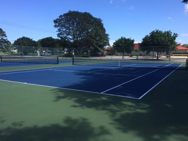 a view of an outdoor space and tennis court