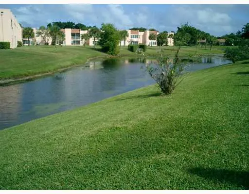 a view of a lake with a house in the background