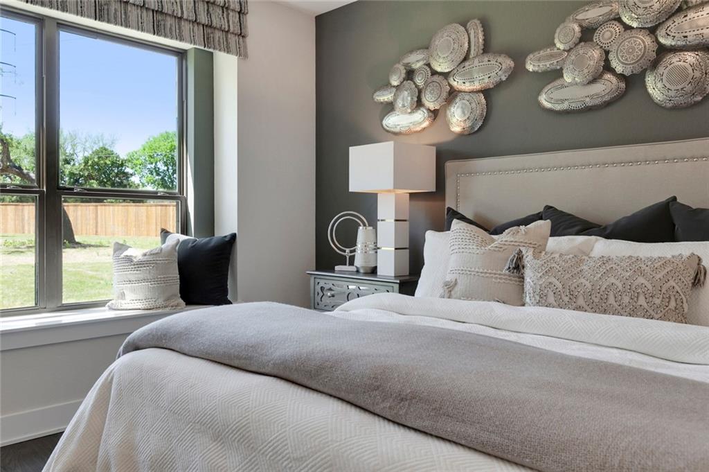 12109 Maypole Bend Austin, TX 78717 - Photo 14 of 27 a bedroom with a large bed and a large window