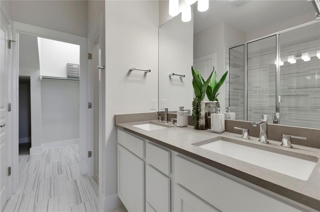 12109 Maypole Bend Austin, TX 78717 - Photo 16 of 27 a bathroom with a double vanity sink and a mirror