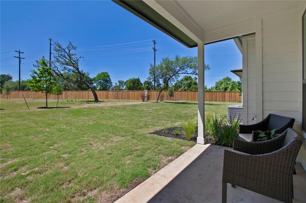 12109 Maypole Bend Austin, TX 78717 - Photo 22 of 27 a view of a chair and table in the back yard of the house
