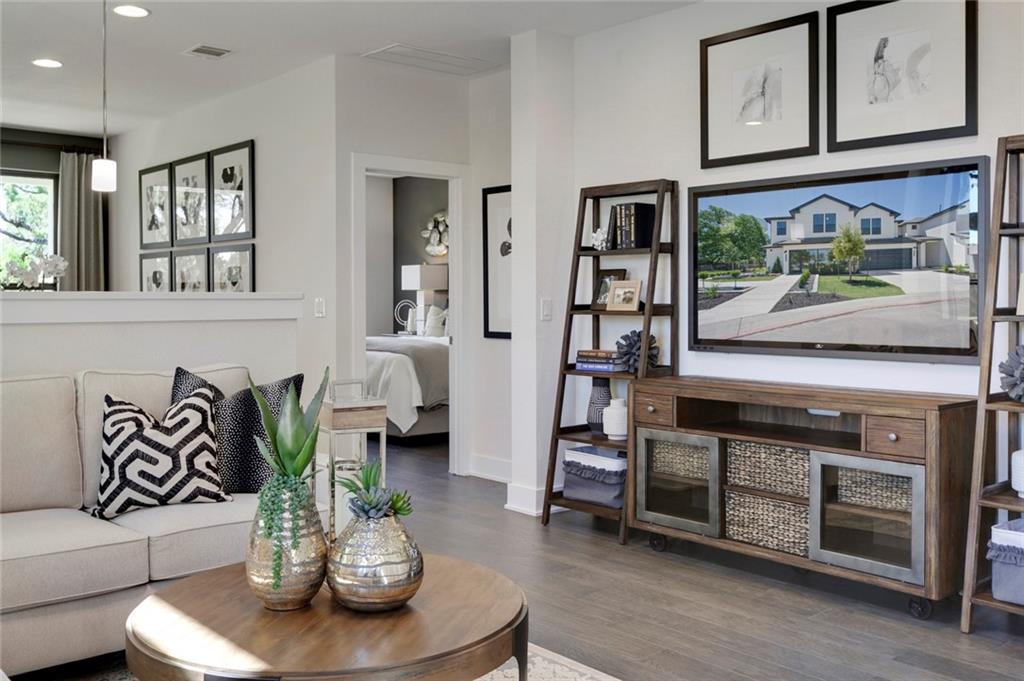 12109 Maypole Bend Austin, TX 78717 - Photo 3 of 27 a living room with furniture and wooden floor