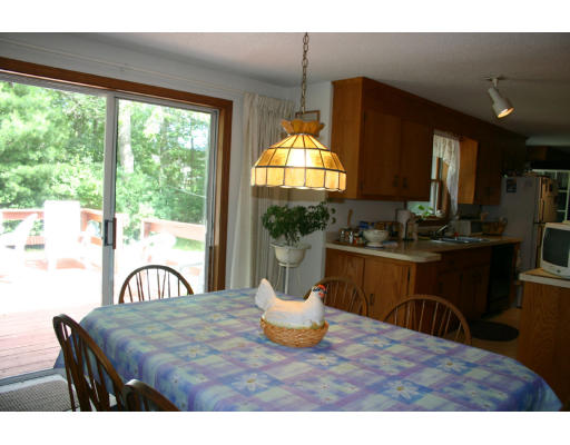 112 Skunknet Road Barnstable, MA 02632 - Photo 3 of 19 a view of a dining room with furniture window and outside view