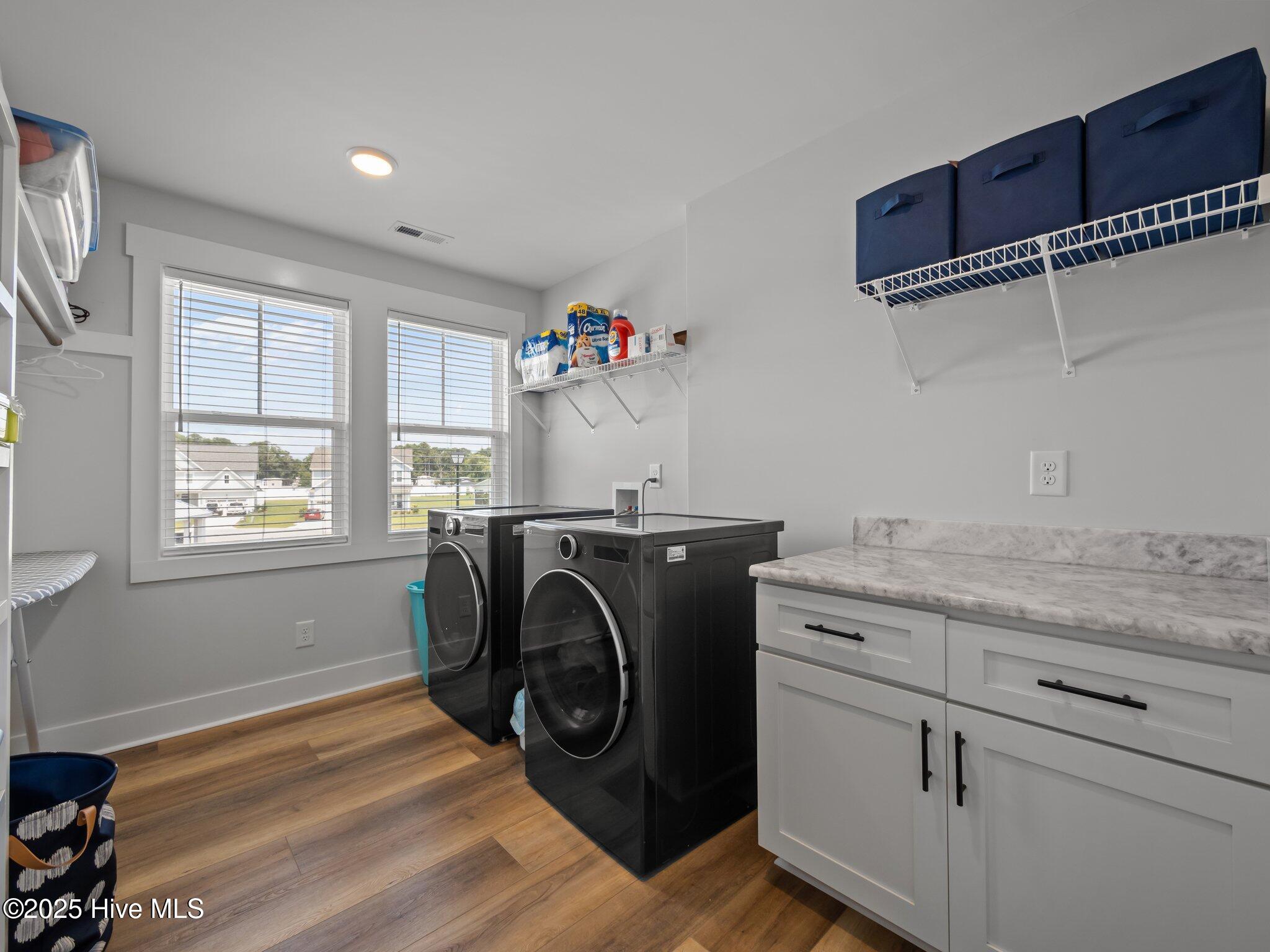 208 Coastline Circle Cedar Point, NC 28584 - Photo 40 of 66 Laundry Room with wood shelving and storage