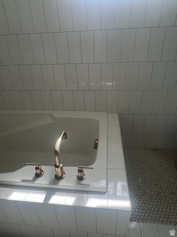 4740 West 25 North West Point, UT 84015 - Photo 11 of 15 White subway tile bathtub surround with an integrated bathtub