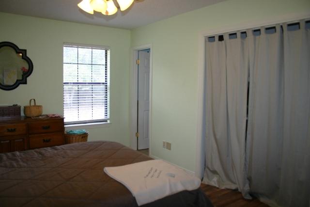 6540 Possum Ridge Road Crestview, FL 32539 - Photo 12 of 23 a bedroom with a bed and a window