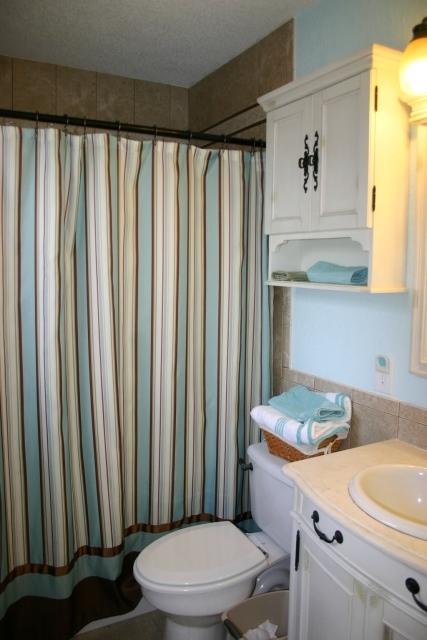 6540 Possum Ridge Road Crestview, FL 32539 - Photo 14 of 23 a bathroom with a granite countertop sink and a toilet