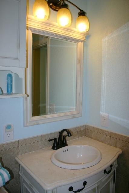 6540 Possum Ridge Road Crestview, FL 32539 - Photo 15 of 23 a bathroom with a sink and a mirror