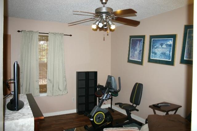 6540 Possum Ridge Road Crestview, FL 32539 - Photo 16 of 23 a view of a workspace with furniture and a window