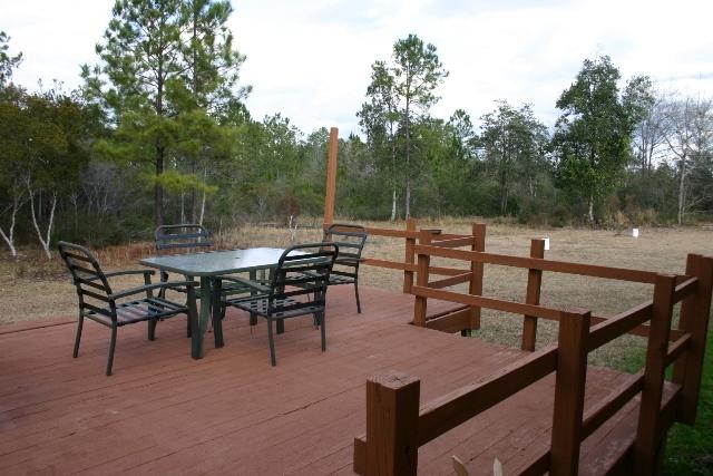 6540 Possum Ridge Road Crestview, FL 32539 - Photo 20 of 23 a view of a outdoor space with seating area