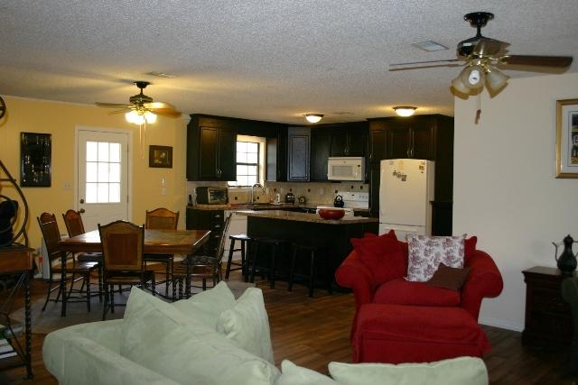 6540 Possum Ridge Road Crestview, FL 32539 - Photo 3 of 23 a living room with furniture and a chandelier