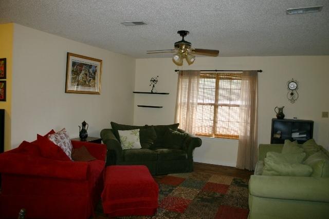 6540 Possum Ridge Road Crestview, FL 32539 - Photo 9 of 23 a living room with furniture chess board and a window