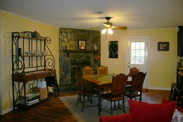 6540 Possum Ridge Road Crestview, FL 32539 - Photo 10 of 23 a view of a livingroom with furniture and a flat screen tv