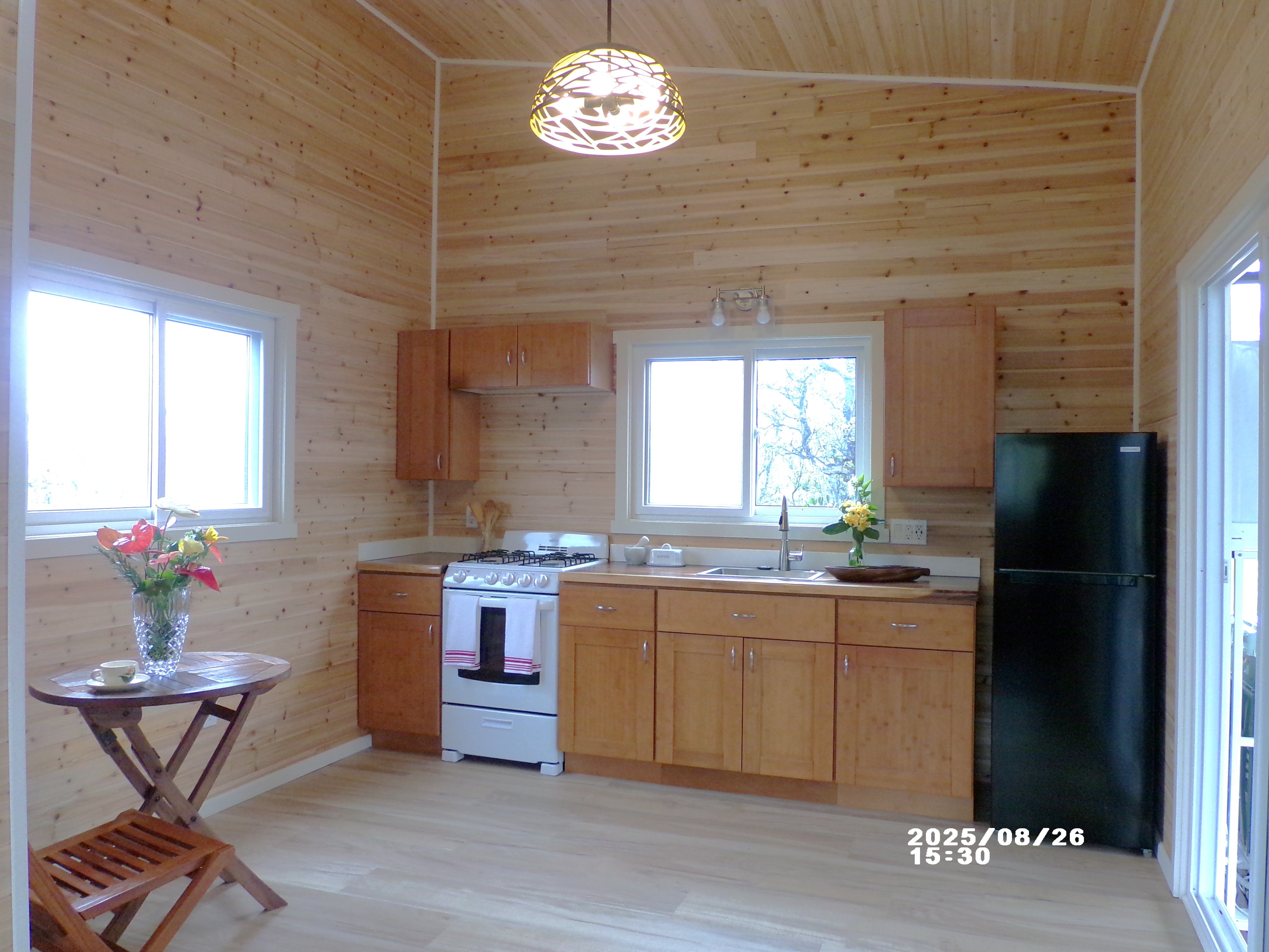 11-3048 Ala Naualani Road Mountain View, HI 96771 - Photo 8 of 29 a kitchen with a cabinets and window