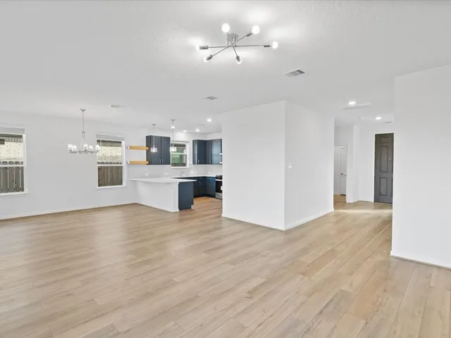 a view of kitchen with cabinets and wooden floor